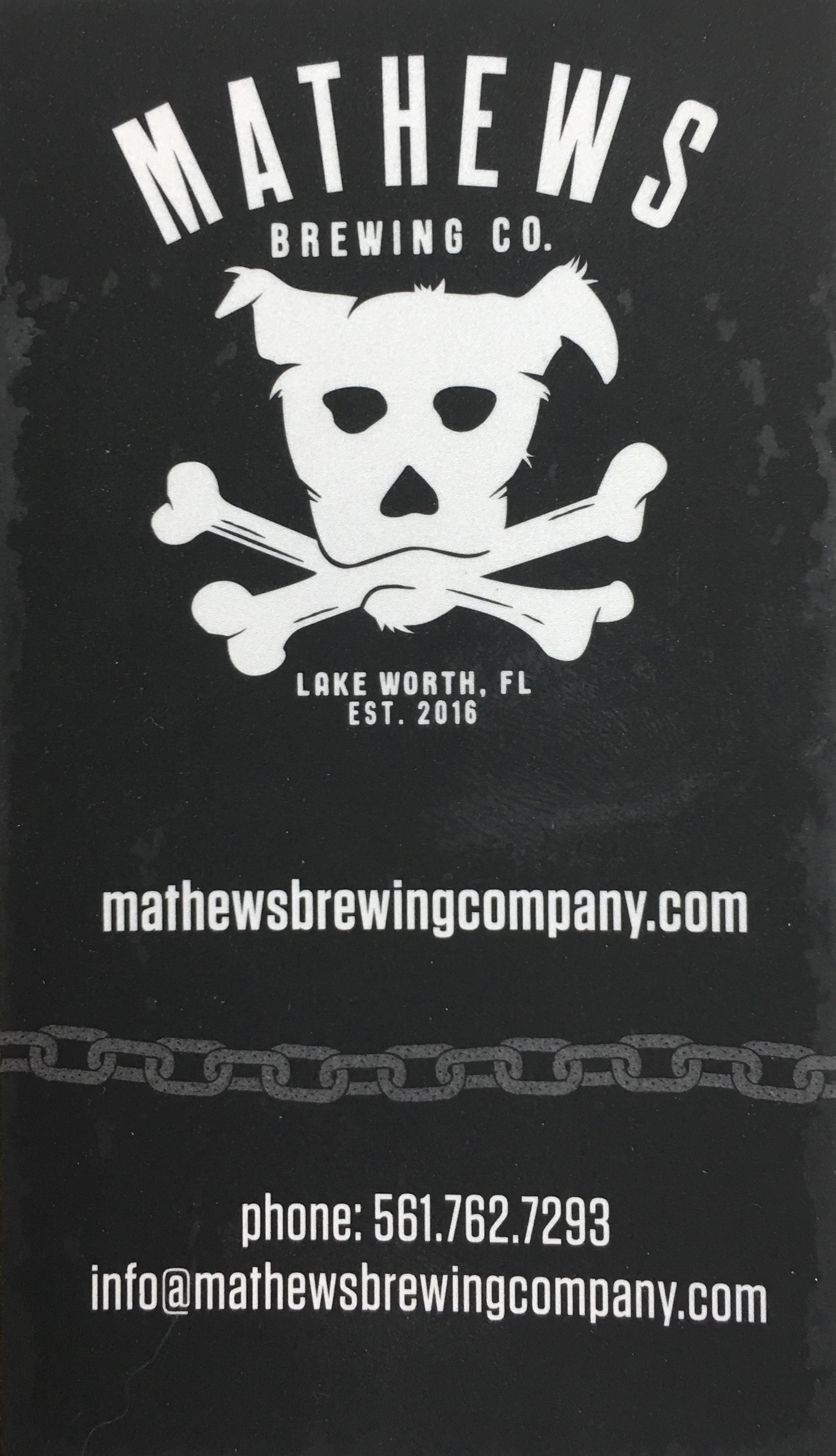 Pictured is Mathews Brewing Co business card, with link to their website 